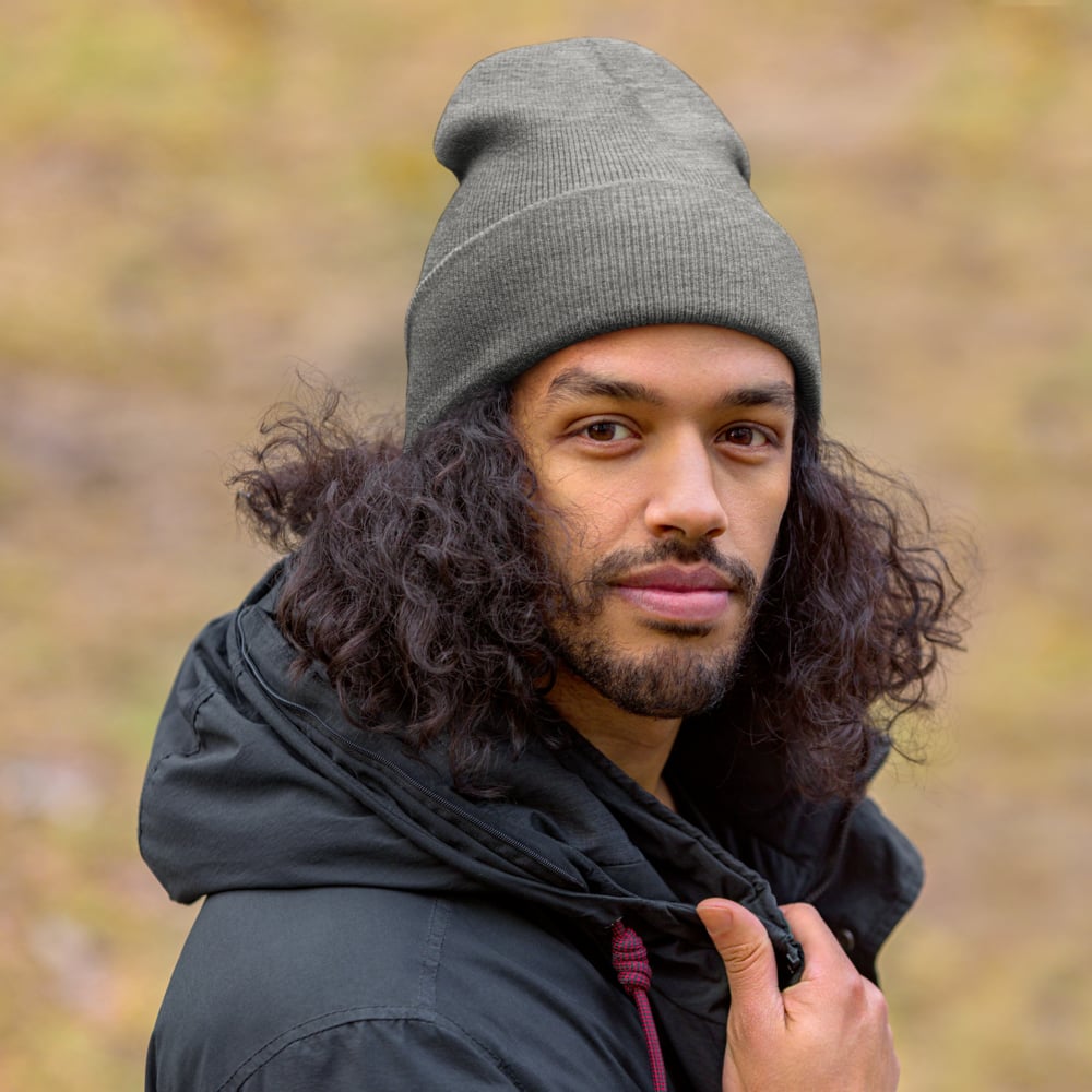 Custom beanie worn by male model outdoors, branded promotional knit hat for cold weather events