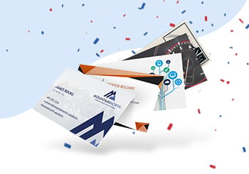 Custom business cards displayed with patriotic confetti, available at a discount through FreeLogoServices' Red, White & Blue sale