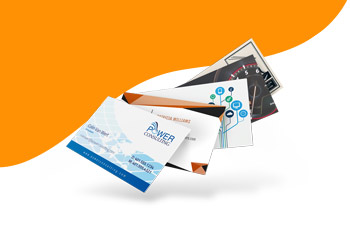 Various business card templates fanned out, offering 30% off in FreeLogoServices Black Friday sale.